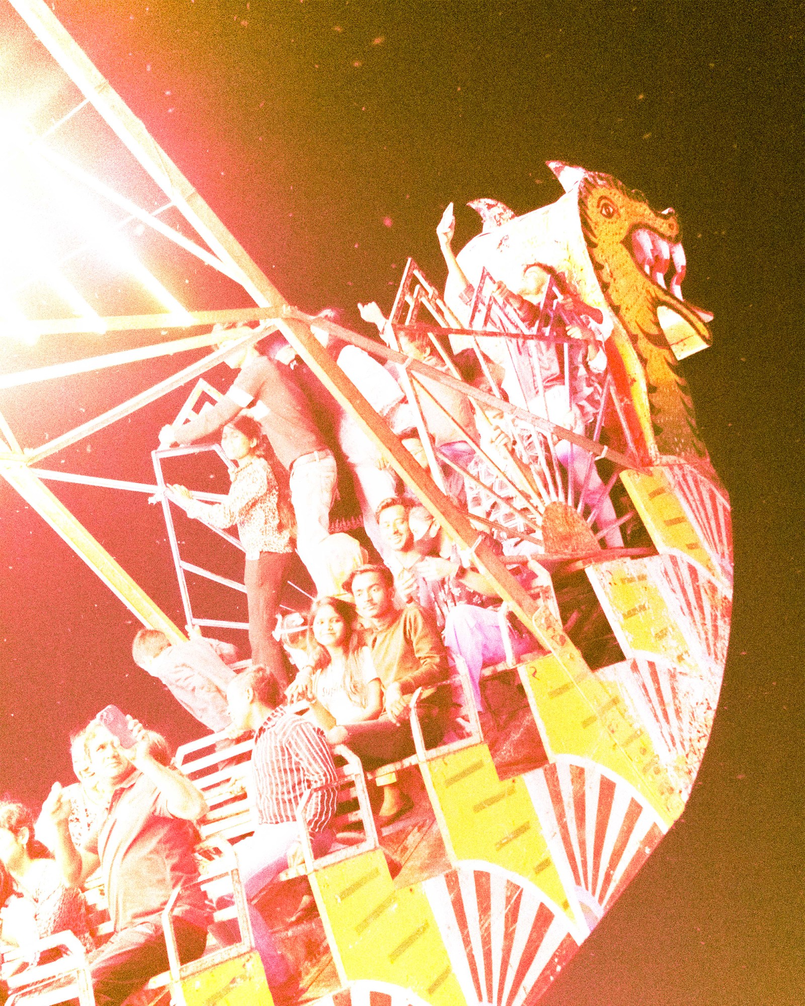 A group of people in India on a fairground ride