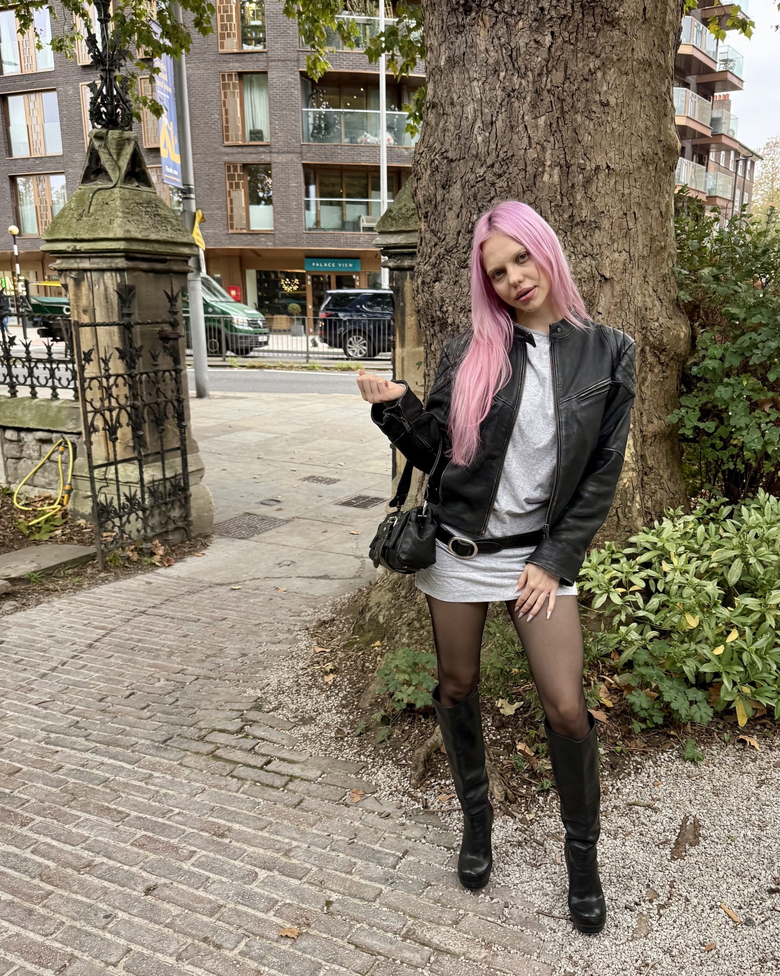 adela pop star photograph pink hair wearing leather jacket and boots
