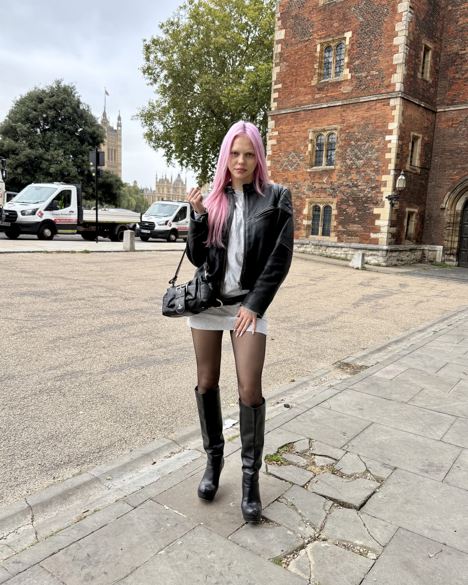 adela pop star pink hair in london wearing leather jacket and boots