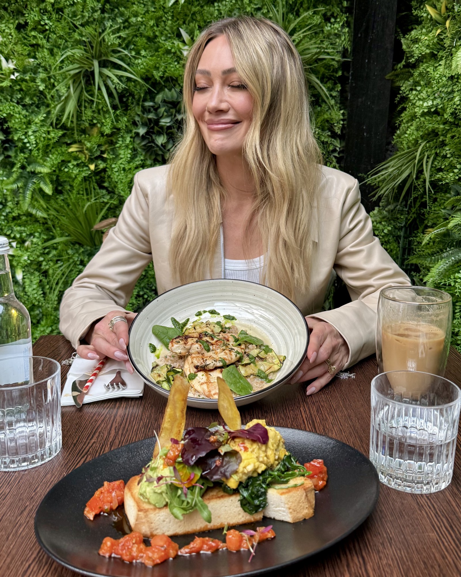 hilary duff holding a plate of food